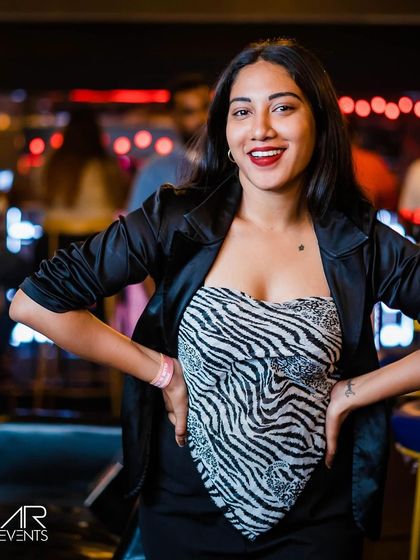 A guest posing at the bar.