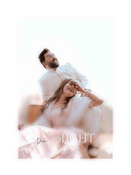 A dreamy, light-filled portrait of the couple sharing a laugh. The soft focus and bright exposure create a romantic and ethereal mood for this engagement photo.