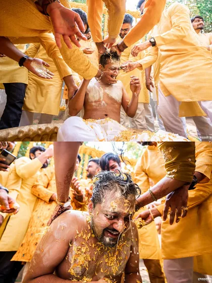 The groom getting completely covered in haldi by his friends. A classic, fun-filled haldi moment.