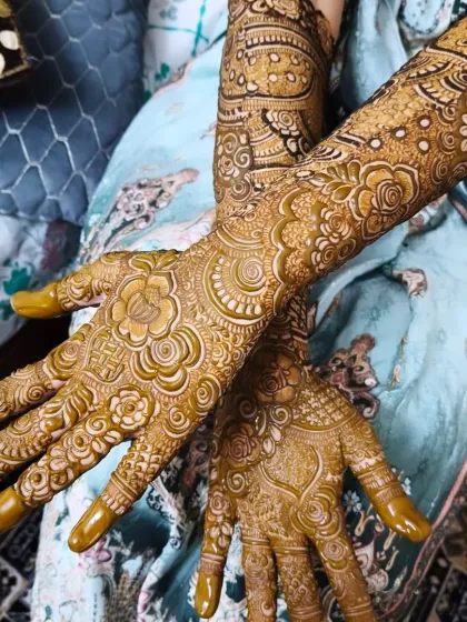 A close-up look at the fresh henna paste. You can see the raised, clean lines of the roses and paisleys, which is key to achieving a sharp, beautiful stain.