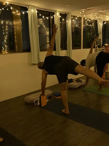 Students in our group class work on Ardhachandrasana (Half Moon Pose), a balancing posture that strengthens the entire body.