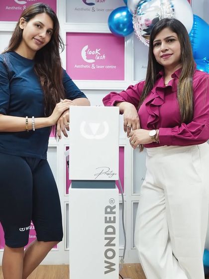 This radiant smile says it all. I am standing with a happy client next to the Wonder machine after her muscle-building and fat-burning treatment. Seeing her satisfaction is my biggest motivation.