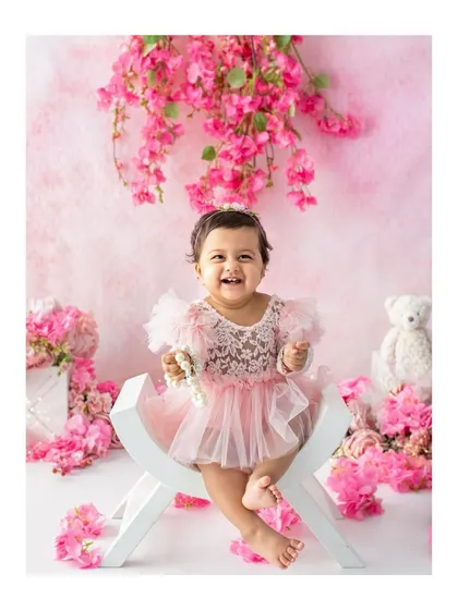 Surrounded by soft pink blossoms, this little one's smile is the brightest flower of all. This portrait from a first birthday session combines a touch of color with my simple style for a beautiful, celebratory feel.