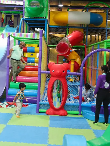 Our multi-level play structure offers endless opportunities for climbing, exploring, and adventure. Even adults can't resist joining in on the fun sometimes.