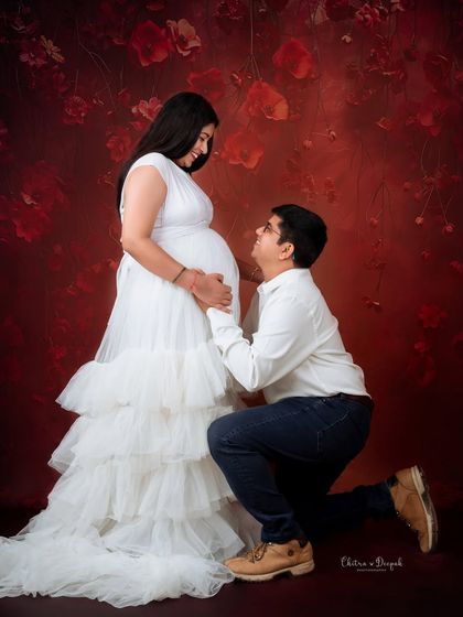 A classic proposal-style pose, but for the baby! This is a romantic and timeless shot that every couple loves.
