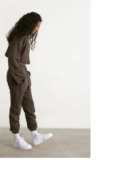 A side-profile shot from the Antigravity campaign, showing the relaxed fit and silhouette of the co-ord set.