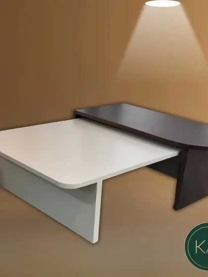 A two-tone, multi-level coffee table in our workshop. This piece, with its contrasting finishes and modern design, is a testament to our creative and functional approach to furniture making.