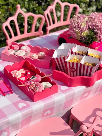 A snapshot from a vibrant, Barbie-themed birthday party. I designed the entire dessert table with custom treats like branded cookies, pink cakesicles, and gourmet popcorn, ensuring every detail was picture-perfect.