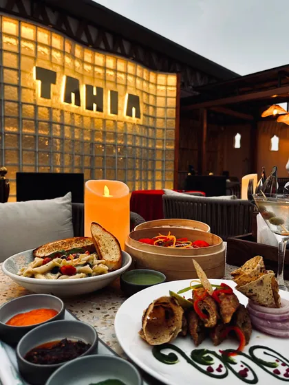 A beautiful food spread at Tahia, Noida. This is how I showcase the dining experience for restaurant collaborations, focusing on the ambiance and the delicious food.