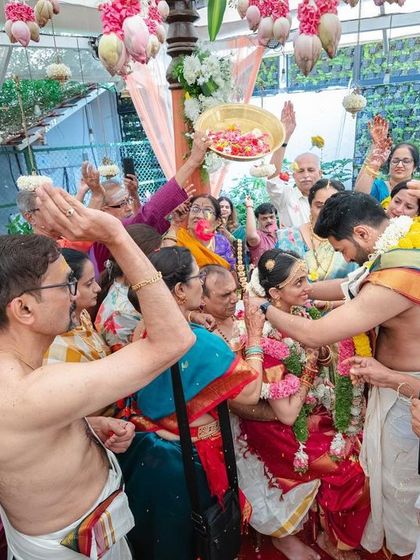 The pivotal 'tiethethali' moment, surrounded by loved ones. We ensure the ceremony space is designed to be both beautiful and functional for these important South Indian wedding rituals.