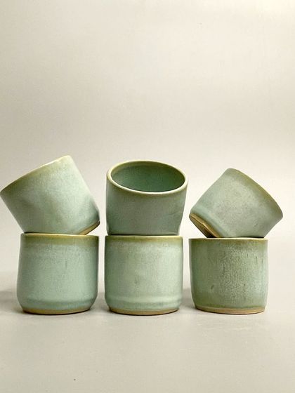 A full set of six seafoam green tumblers. These are perfect companions for your morning coffee, afternoon tea, or any beverage ritual.