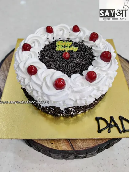 A tribute to a classic flavor. This Black Forest cake is made the traditional way with layers of chocolate sponge, whipped cream, and cherries, a nostalgic favorite for Dad's birthday.
