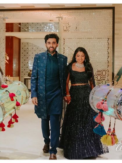Making an entrance with the beat of the dhol. This couple entered their Sangeet flanked by dhol players, immediately setting a high-energy, celebratory tone for the night.