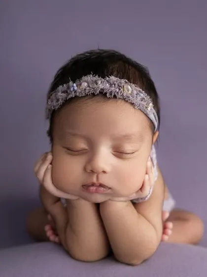 This is the magic of a classic newborn portrait. With gentle posing and soft lighting, I focus entirely on your baby's serene beauty, creating a simple, elegant, and timeless piece of art.
