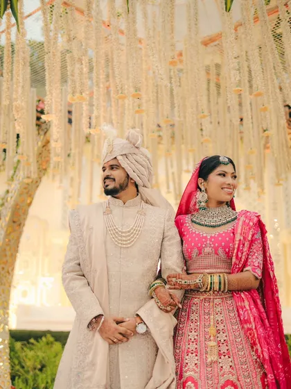 A proud moment as husband and wife. This portrait captures the couple standing together, looking out towards their future.