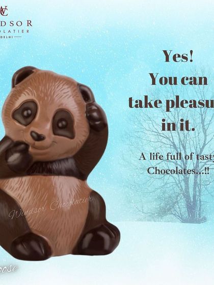 A playful chocolate panda sculpture, made with both milk and dark chocolate to capture its iconic markings.