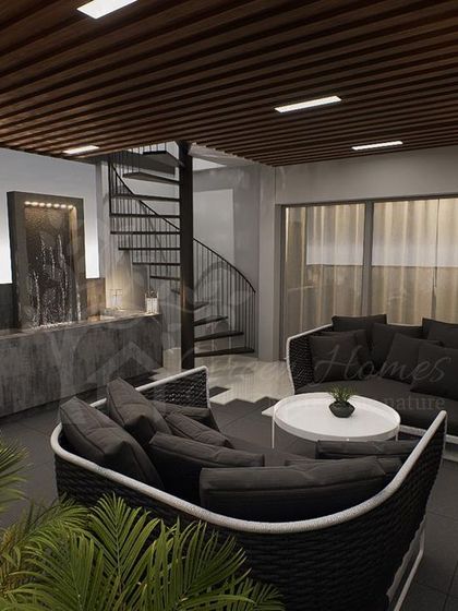 A wider shot of the Ashok Vihar terrace, showing the relationship between the seating lounge, the water feature, and the spiral staircase, creating a cohesive and functional layout.