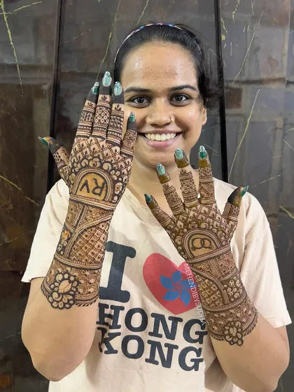 Another smiling shot of the bride-to-be with her custom engagement henna.
