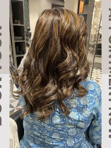 Another view of the same stunning highlights, styled into perfect waves to showcase the color dimension.