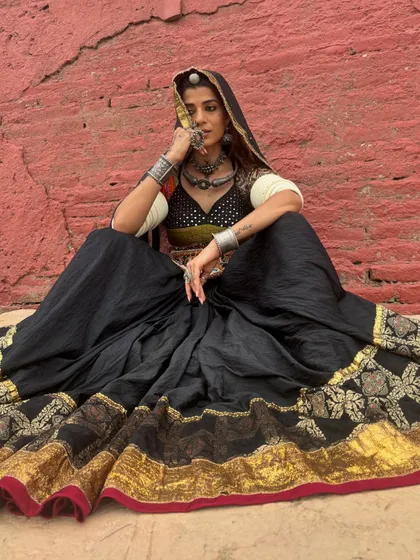 For this Navratri special campaign, I styled a traditional Ghagra Choli with authentic silver jewelry against a rustic red wall. The concept was to celebrate the festive spirit with a look that is both powerful and deeply rooted in cultural heritage.