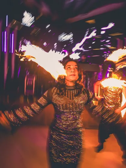 We bring more than just music. Here, a fire dancer adds to the spectacle, creating a high-impact visual experience that elevates the party to a whole new level.