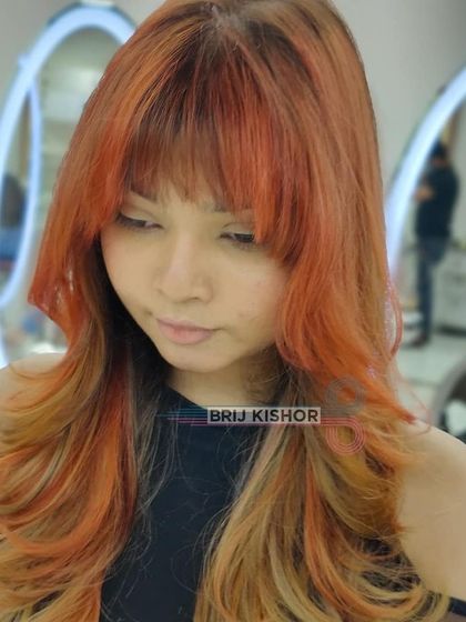 A side profile of the Y2K hair, showing the blend of orange and blonde tones.