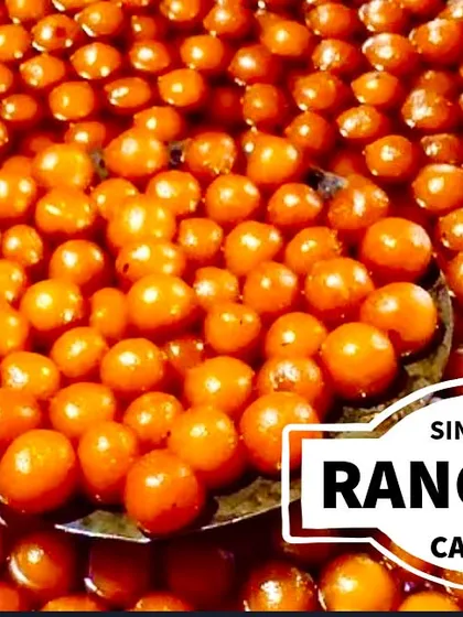 A large cauldron filled with freshly made Gulab Jamuns, soaking in sweet syrup. This shows our capacity to handle large-scale catering for weddings and festivals without compromising on quality.