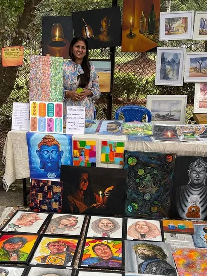 My wife helping manage the stall at Chitra Santhe.