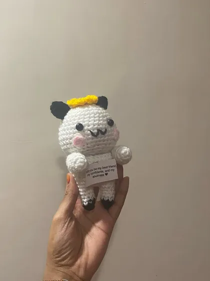 A close-up of the message doll. The note reads, "Will you be my best friend, my confidante, and my soulmate?"