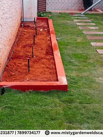 A look at the garden bed preparation and irrigation setup before planting. We install drip lines and sprinklers to deliver water efficiently right where it's needed.