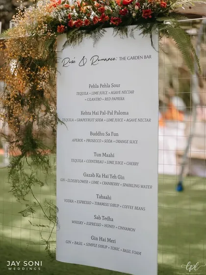 A personalized bar menu for the "Rose & Romance" garden bar, with a custom cocktail list featuring creative, themed names.