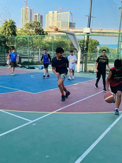 A player dribbles the ball down the court during a fast break.