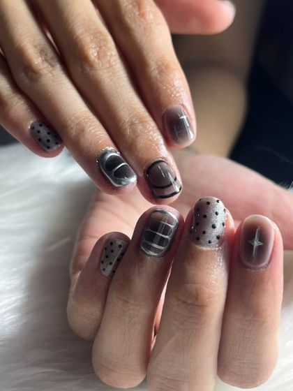 Why settle for one design? This edgy look combines chrome, polka dots, and abstract lines for a mixed-media manicure that is truly one-of-a-kind.