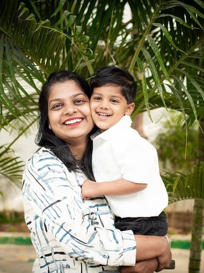 A joyful hug between a mother and her son. Capturing these spontaneous moments of affection is what makes family photography so special.