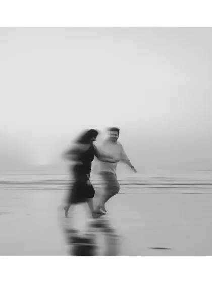 An artistic motion-blur photograph on the beach. This abstract, monochrome image captures the feeling and movement of a memory rather than a static moment.