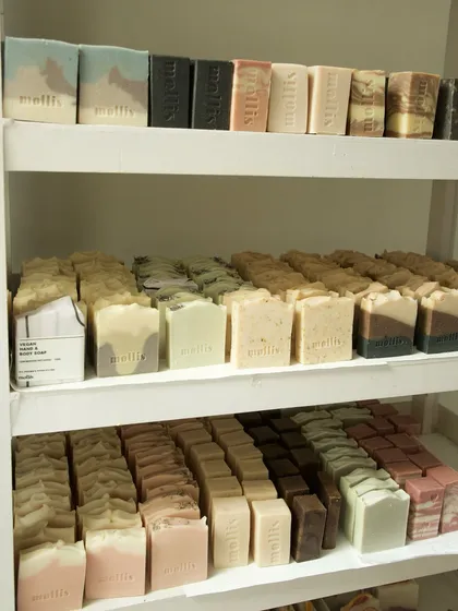 A view of my curing racks, filled with freshly made soaps. The studio smells better than any office!