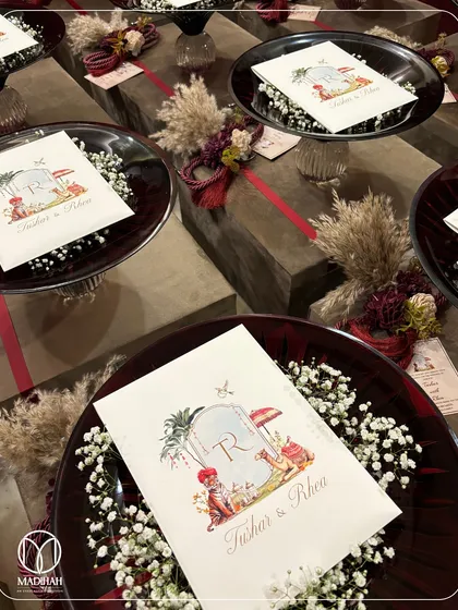 An overhead shot of the wedding favor setup, showing multiple Crimson Crystal Bowls arranged with custom cards and rustic floral elements. This is how I help clients create a cohesive and memorable gifting experience.