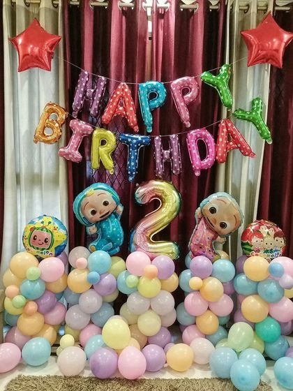 A compact Cocomelon setup perfect for home celebrations, featuring character foil balloons and a pastel balloon arrangement.