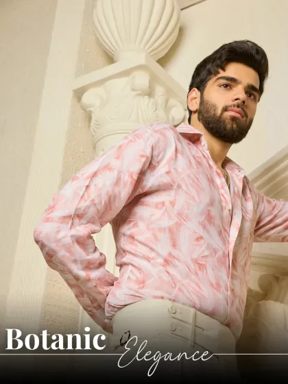 Botanic Elegance. This graphic-enhanced image highlights the soft, natural pattern of the pink linen shirt, a perfect choice for sophisticated summer style.