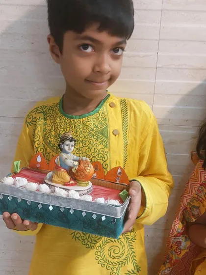 Another proud creator with his Krishna-themed decorative box. These projects are perfect for festivals like Janmashtami and give children a tangible connection to the celebration.