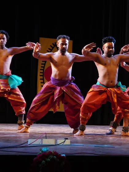 A synchronized group sequence showcasing the strong, grounded stances of Mayurbhanj Chhau. This foundational posture, known as 'Chauk', is the base from which all powerful movements originate.