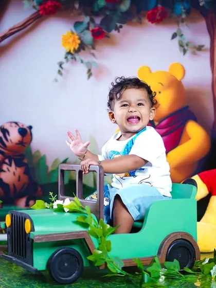 A huge, infectious smile from this happy toddler, who is having a wonderful time with his favorite characters.