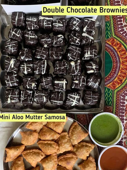 A perfect party combo of Mini Aloo Mutter Samosas and Double Chocolate Brownies.