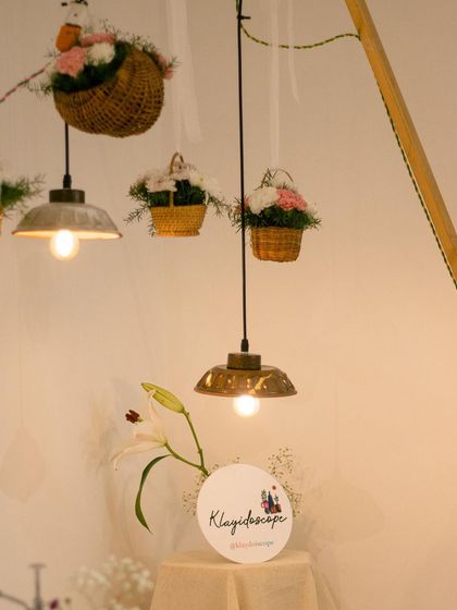 We even make our own lighting. These ceramic pendant lamps were created by students for our exhibit, adding a warm, handmade glow to the space.