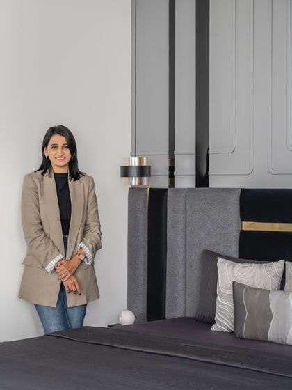Standing in a finished bedroom we meticulously crafted. Every project is a journey, and I am proud of the dedication my team and I bring to achieve a stunning result.