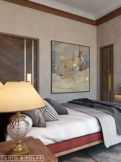 The room features classic furniture and artwork that evokes a sense of nostalgia and heritage. The chevron-patterned wooden doors with brass inlays add a touch of modern craftsmanship.