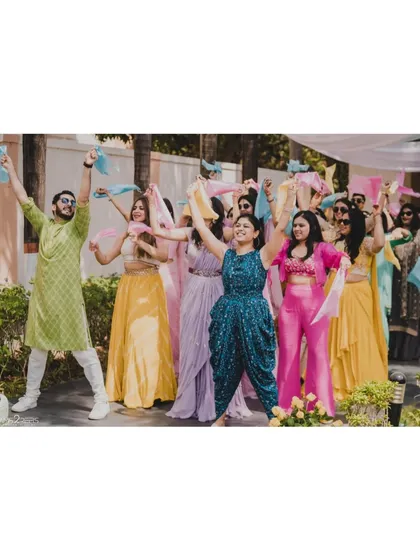 Nothing makes us happier than seeing the whole family light up the stage. This colorful Haldi performance, full of joy and coordinated moves with props, is exactly the kind of fun we love to create.