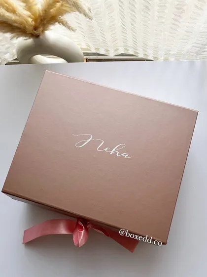 A personalized rose gold gift box for a bridesmaid named Neha, showcasing the elegant custom calligraphy I offer.