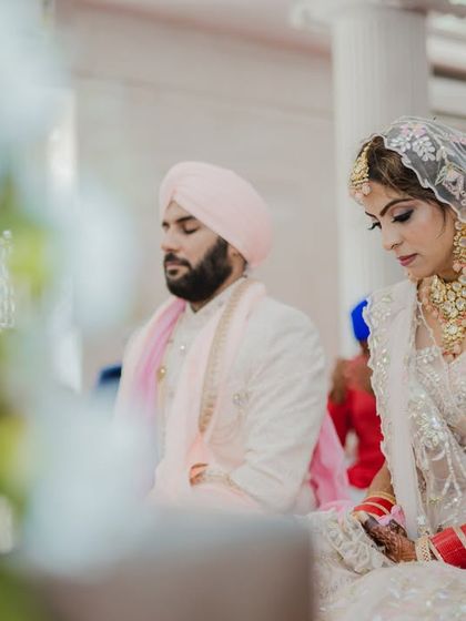 A moment of quiet prayer and reflection for the bride and groom during their Sikh wedding ceremony. We capture the reverence and grace of these sacred moments.
