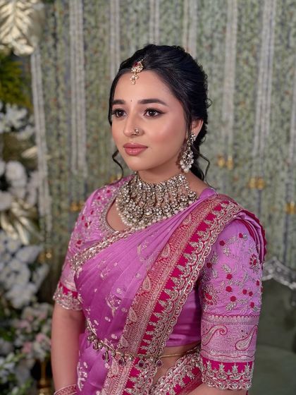 A three-quarter view against a soft-focus background, emphasizing the client's radiant look.